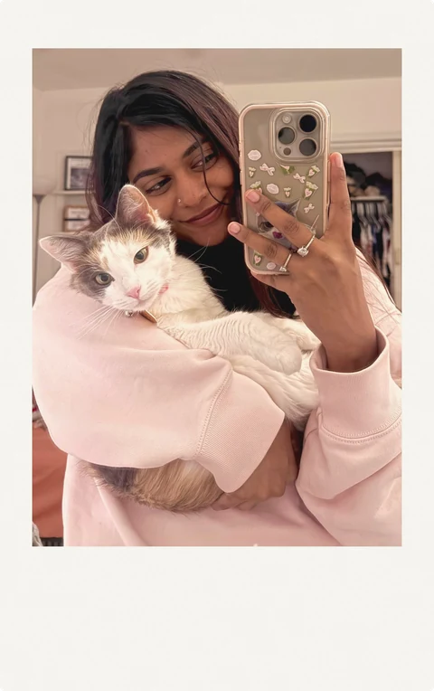 Isha holding her cat